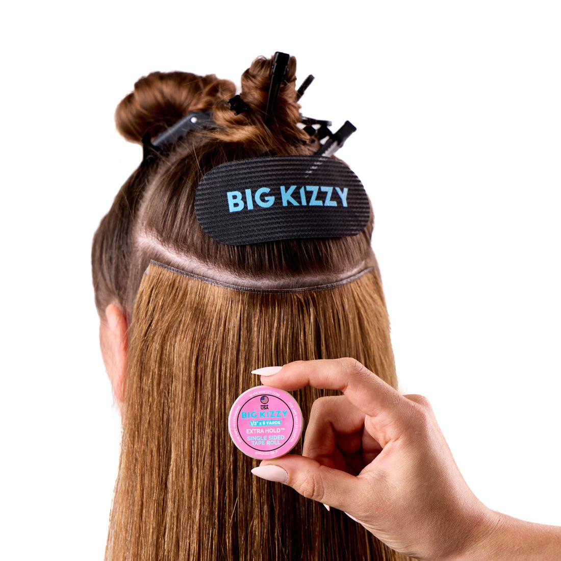 Stylist Holding Big Kizzy Extra Hold Single Sided Tape Roll for Tape Weft Hair Extensions